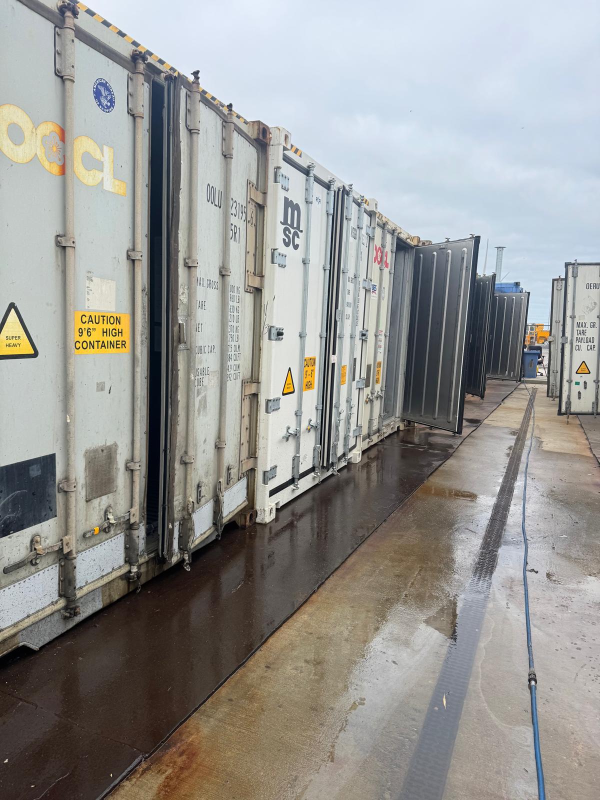 Row of reefer containers being cleaned on-site Rotterdam